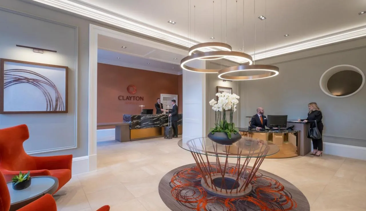 a lobby of a store with people in the background at Clayton Hotel Glasgow City in Glasgow