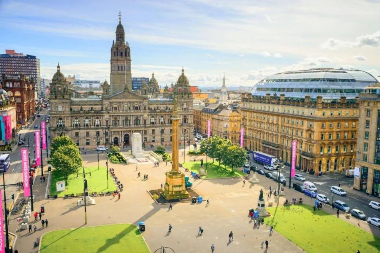 an aerial view of a city with a clock tower at Clayton Hotel Glasgow City in Glasgow